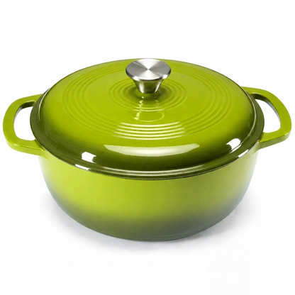 Green enameled cast iron Dutch oven on white background