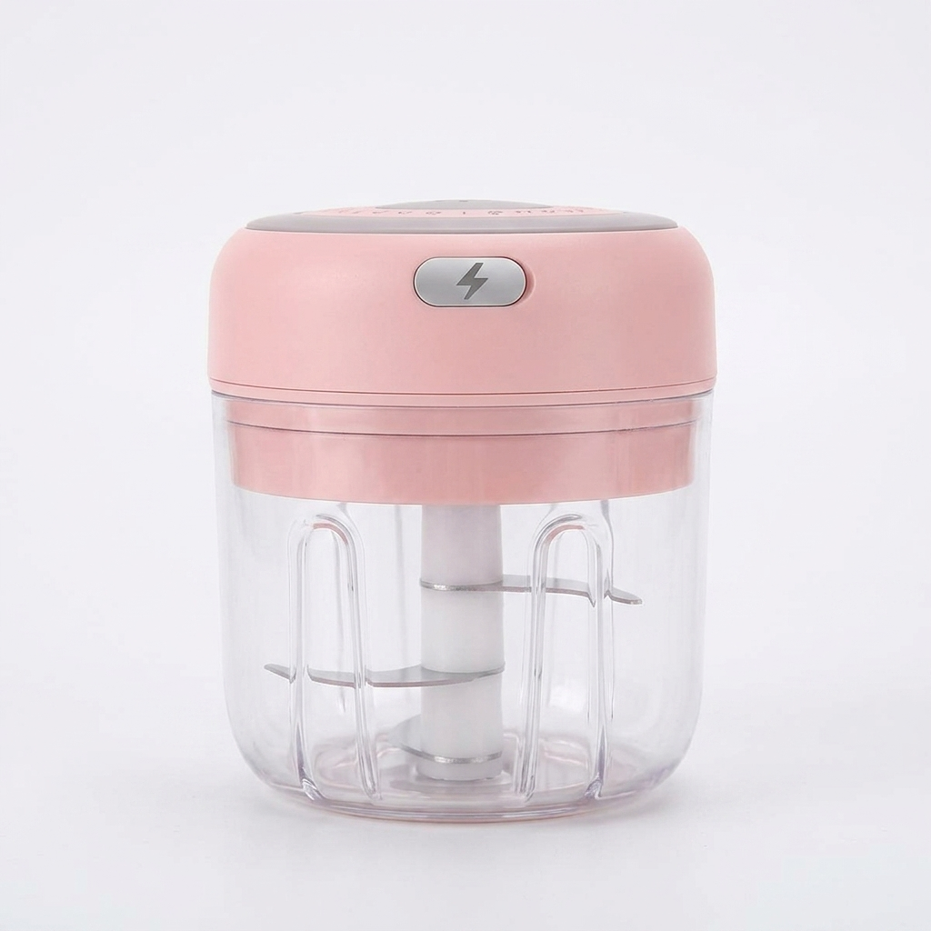 Pink electric garlic chopper on white background