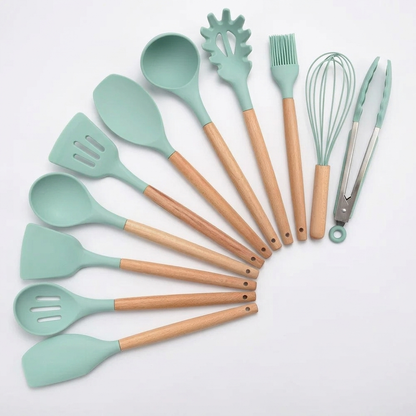 Light green 11-piece silicone utensil set on white background