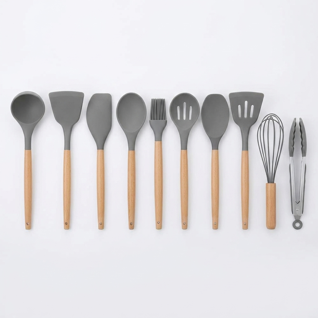 Gray 11-piece silicone utensil set laid out on white background