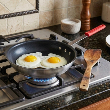 Eggs cooking in the nonstick egg pan on a stovetop